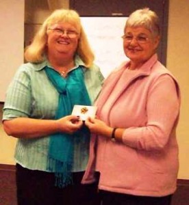 Manager LD Fennell congratulates Hanna Merz for continual volunteer service to PGCOS Outreach Program since 1991.  (October 2009)